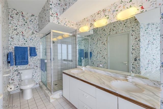 bathroom with vanity, toilet, walk in shower, and tile patterned flooring