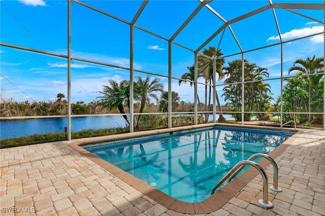 view of pool with a lanai and a patio