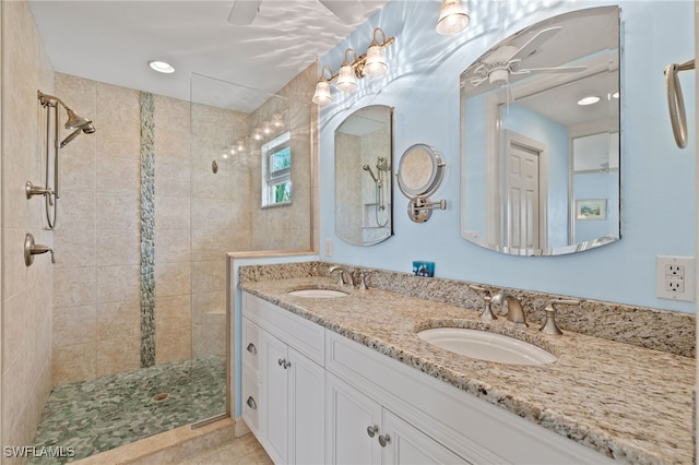 bathroom featuring vanity and a tile shower