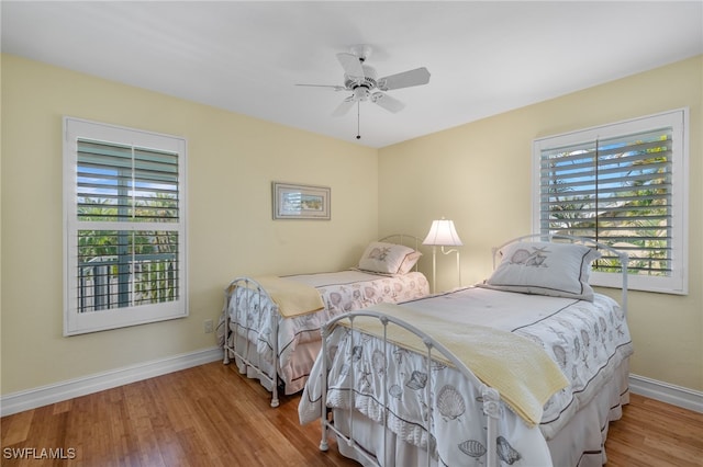 bedroom featuring ceiling fan and hardwood / wood-style flooring