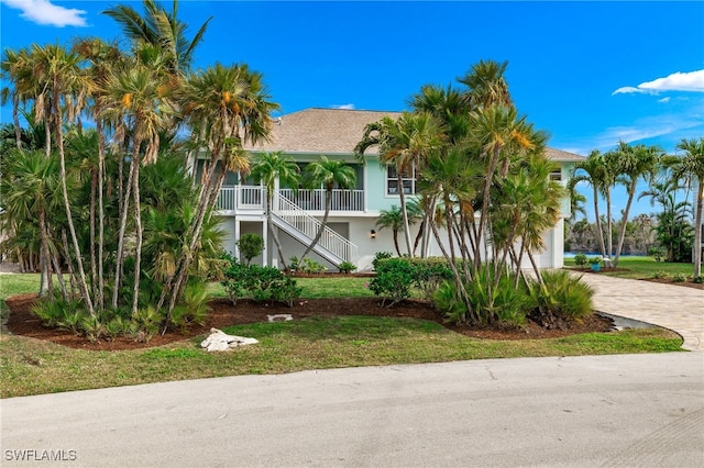 view of front of home with a front lawn and a porch