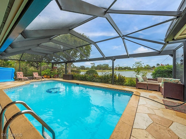 view of pool with outdoor lounge area, a patio area, and a lanai