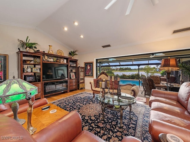 living room with vaulted ceiling, ceiling fan, hardwood / wood-style floors, and crown molding