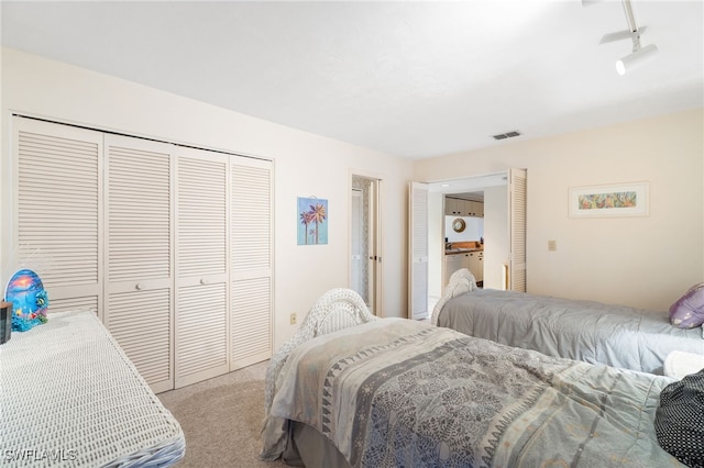 carpeted bedroom featuring a closet