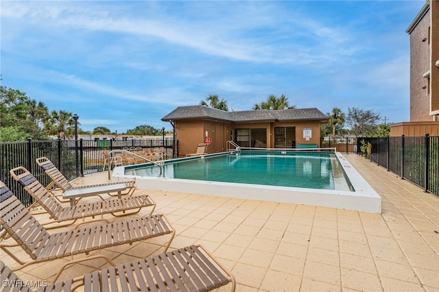 view of swimming pool featuring a patio area