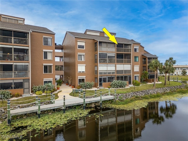 view of property with a water view