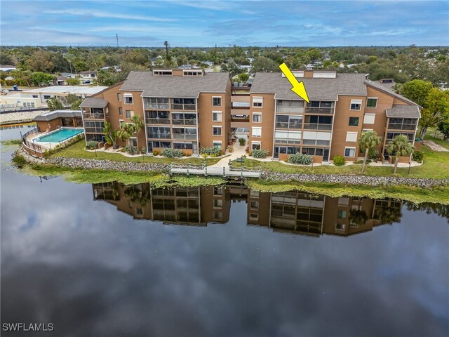 birds eye view of property with a water view