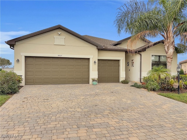 single story home featuring a garage