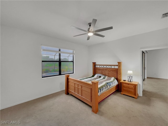 bedroom with ceiling fan and light colored carpet