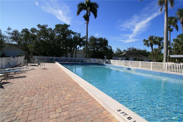 view of swimming pool featuring a patio area