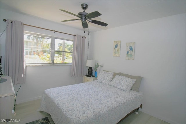 bedroom with ceiling fan and light wood-type flooring