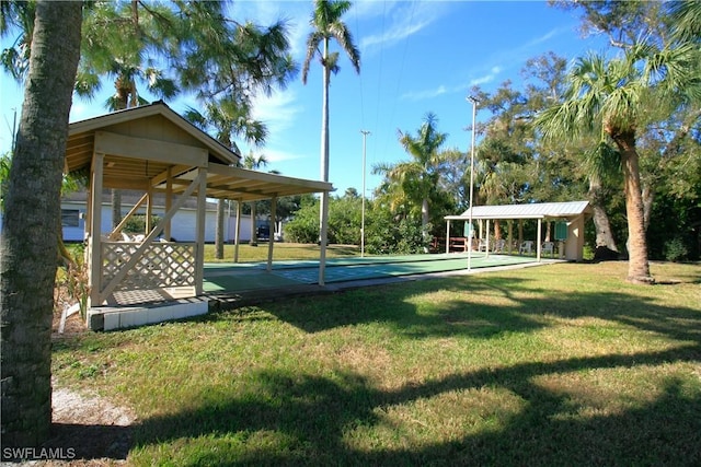 view of property's community with a lawn