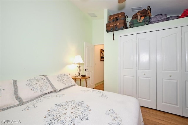 bedroom featuring a closet and light hardwood / wood-style flooring