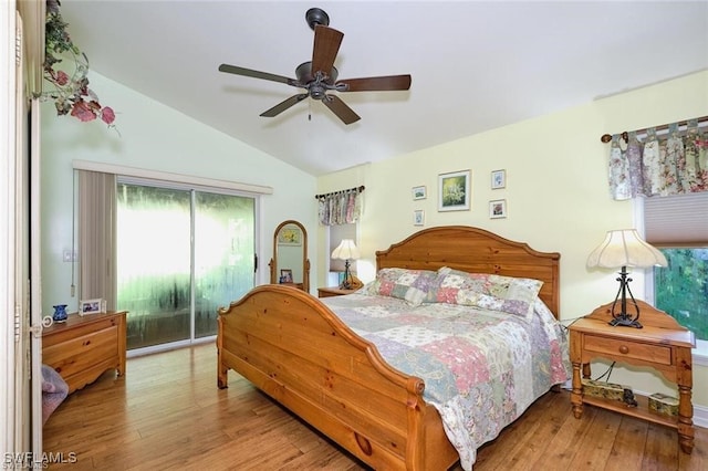 bedroom featuring ceiling fan, light wood-type flooring, and lofted ceiling