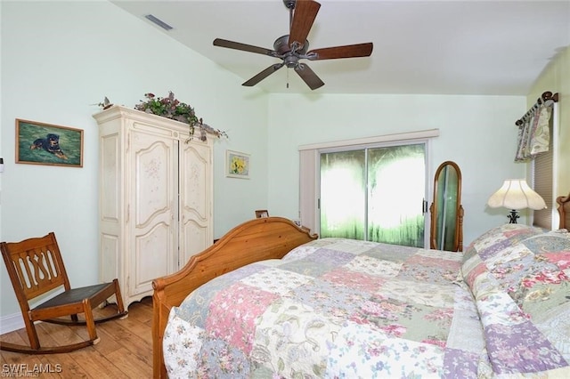 bedroom with vaulted ceiling, ceiling fan, and light hardwood / wood-style floors