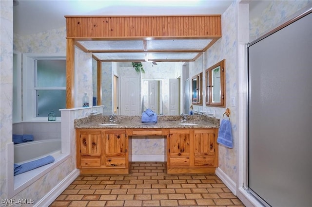 bathroom with separate shower and tub and vanity