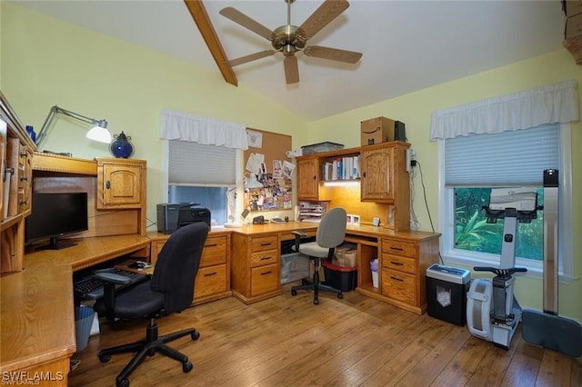 home office with ceiling fan, light hardwood / wood-style floors, and vaulted ceiling