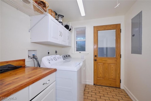 washroom with cabinets, electric panel, and washing machine and clothes dryer