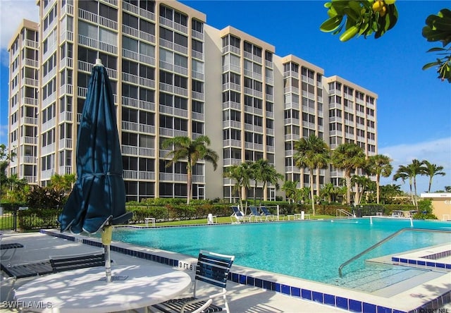 view of swimming pool with a patio