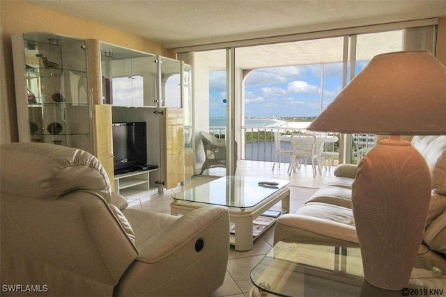 tiled living room featuring a fireplace