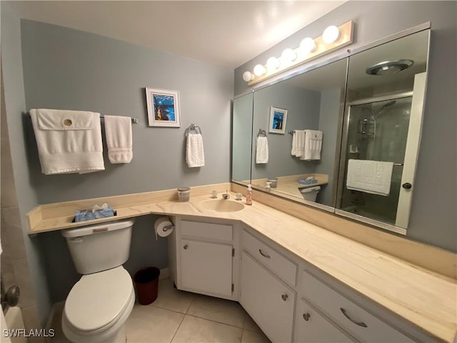 bathroom with walk in shower, tile patterned floors, vanity, and toilet