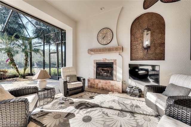 interior space with vaulted ceiling and a tile fireplace