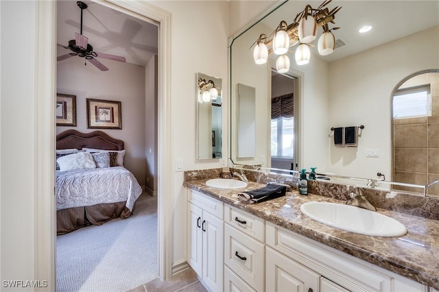 bathroom featuring ceiling fan and vanity