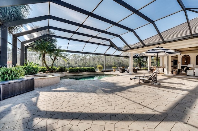 view of pool with a patio area, an in ground hot tub, ceiling fan, and glass enclosure