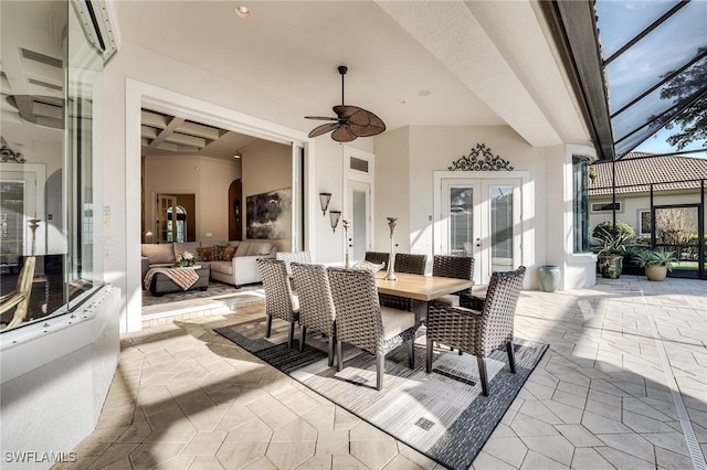 view of patio featuring ceiling fan, outdoor lounge area, a wall unit AC, glass enclosure, and french doors