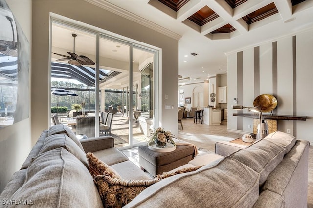 interior space featuring beamed ceiling, crown molding, coffered ceiling, and ceiling fan