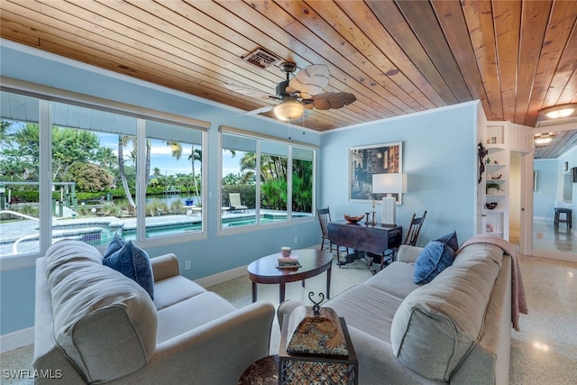 living room with ornamental molding, wooden ceiling, a healthy amount of sunlight, and a water view