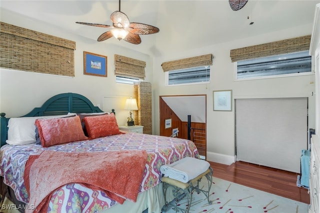 bedroom with hardwood / wood-style flooring and ceiling fan