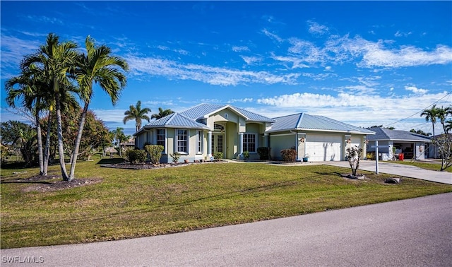 single story home featuring a garage and a front lawn