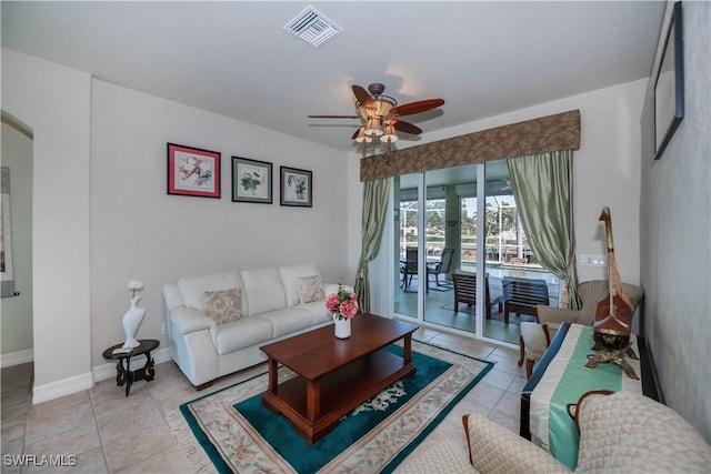 living room featuring ceiling fan and light tile patterned flooring