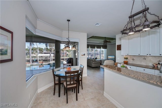 dining room featuring ceiling fan