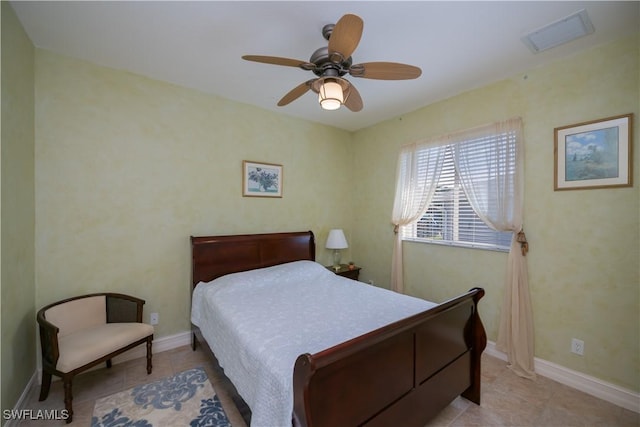 bedroom featuring light tile patterned flooring and ceiling fan