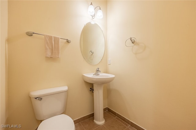 bathroom featuring toilet and tile patterned floors