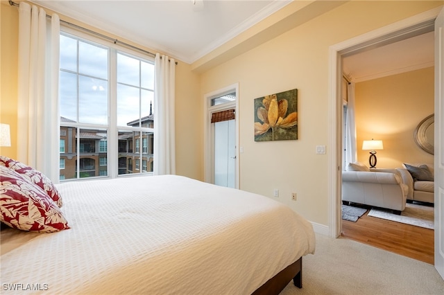 carpeted bedroom with crown molding