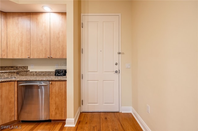 kitchen featuring dishwasher and light hardwood / wood-style floors