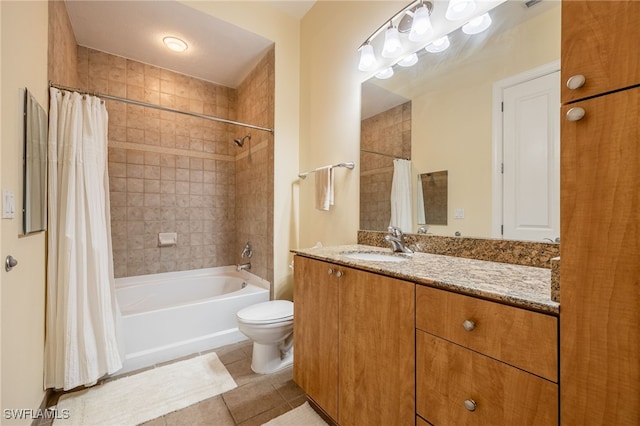 full bathroom with shower / bath combination with curtain, toilet, vanity, and tile patterned flooring