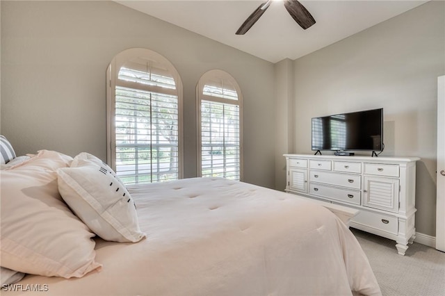 bedroom featuring ceiling fan and light colored carpet