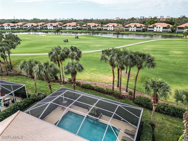 view of pool featuring a lanai and a water view