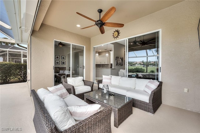 view of patio / terrace with ceiling fan, an outdoor hangout area, exterior kitchen, and glass enclosure