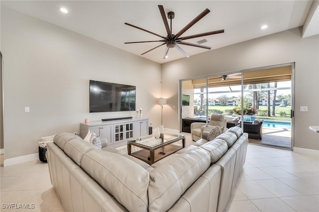 living room featuring ceiling fan and light tile patterned floors