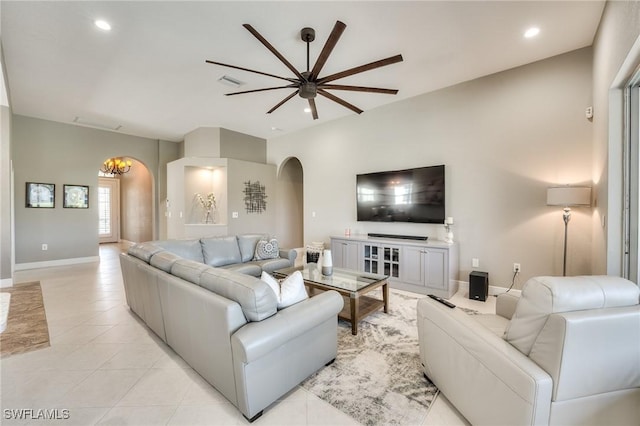 living room featuring ceiling fan and light tile patterned floors