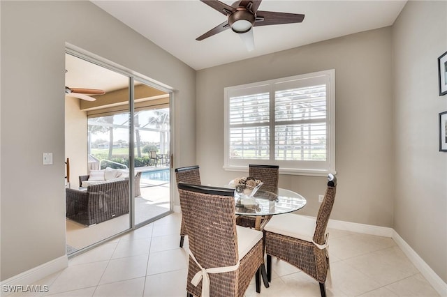 tiled dining area featuring ceiling fan