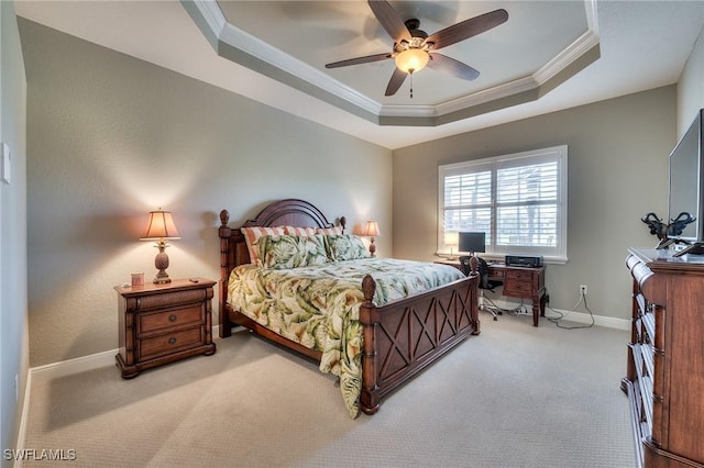 bedroom featuring ceiling fan, crown molding, a raised ceiling, and carpet floors