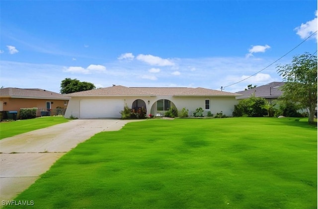 single story home featuring a garage and a front lawn