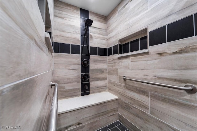 bathroom featuring tiled shower