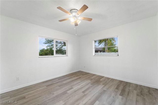 unfurnished room featuring ceiling fan and light hardwood / wood-style floors